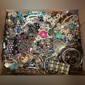 Some broken jewelry and earring onesies and some bracelets necklaces & brooches